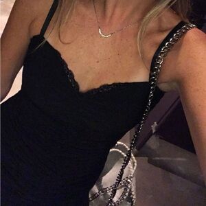 Black ruched bodycon mini dress with black lace neckline